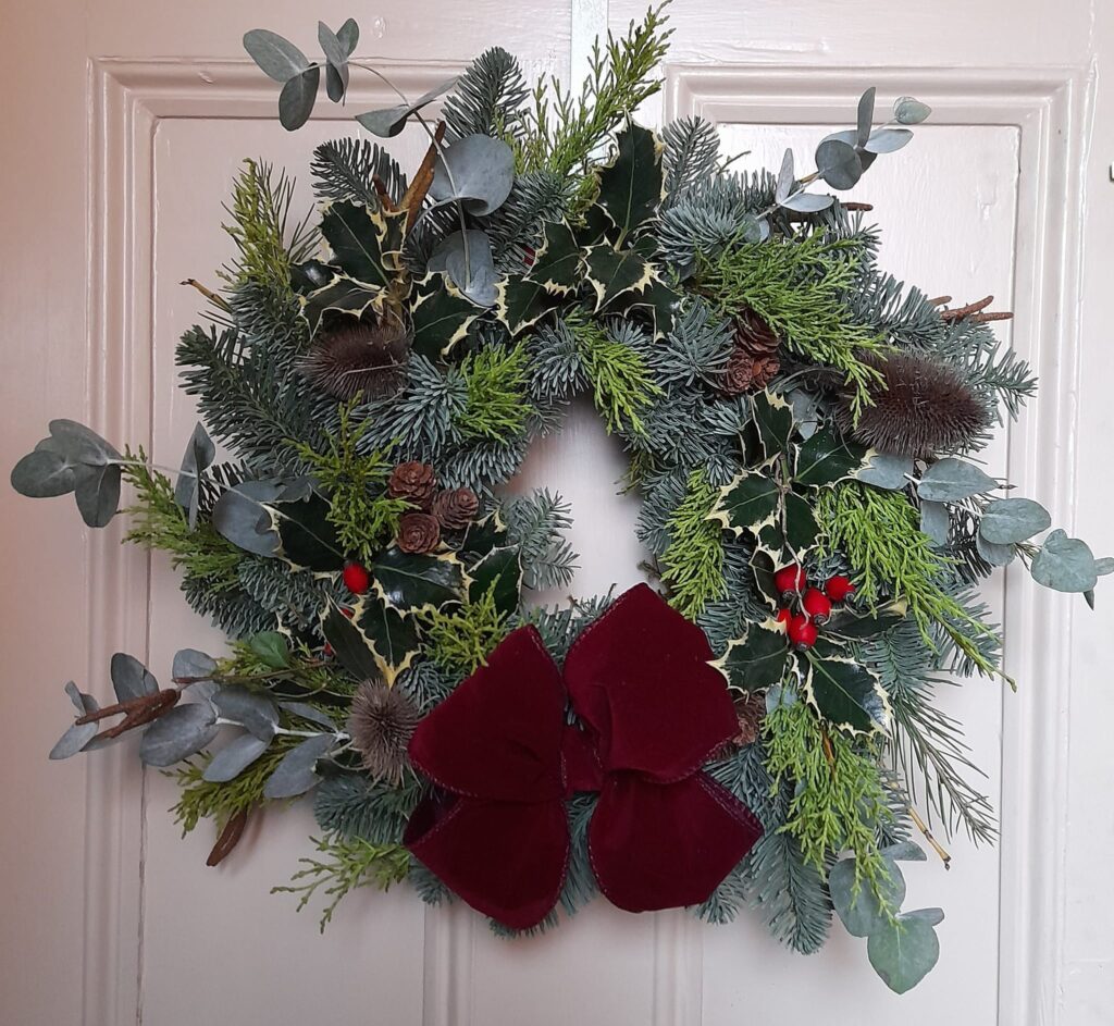 christmas wreath with a dark red bow